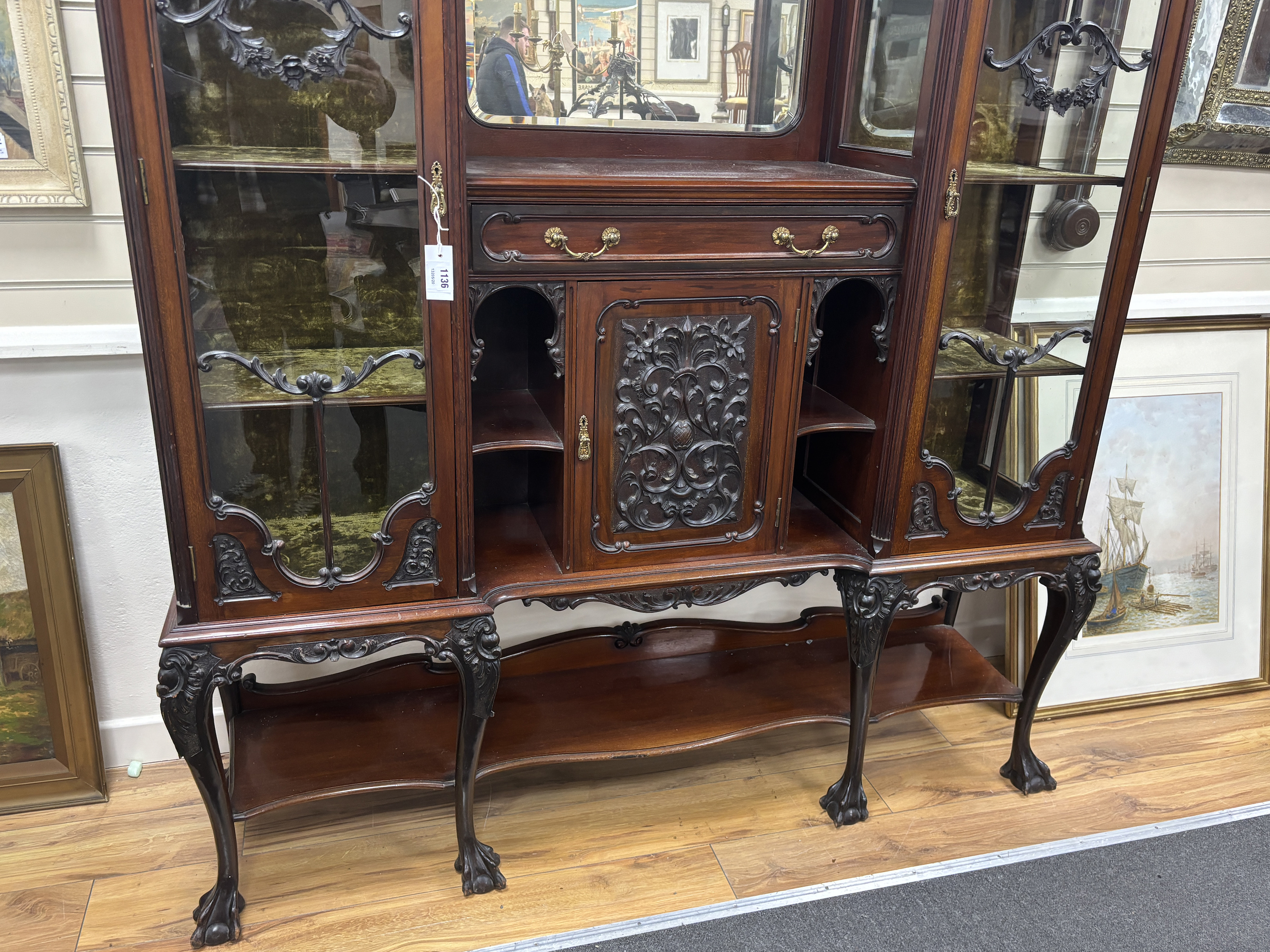 A late Victorian glazed carved mahogany side cabinet, width 157cm, depth 38cm, height 228cm